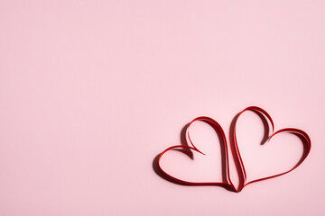 Two beautiful hearts on a pink background, symbol of love, Valentine's Day, happy woman, mother,...