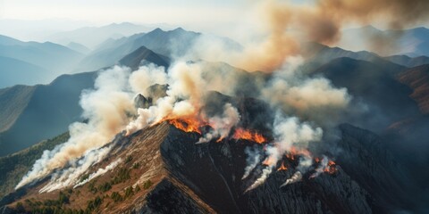 Obraz premium A captivating image of a mountain enveloped in billowing smoke. Perfect for illustrating environmental issues or showcasing the power of nature.