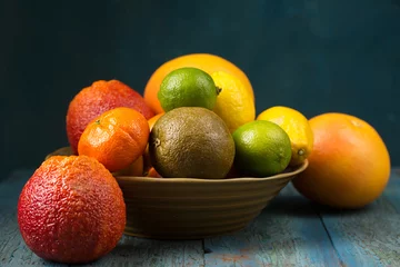 Foto op Plexiglas A variety of colorful citrus fruits, rustic still life © Mallivan