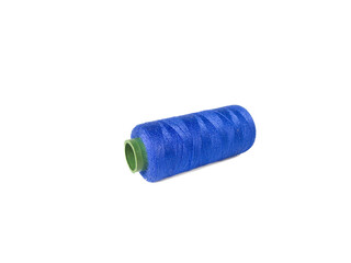 Blue sewing thread over white background