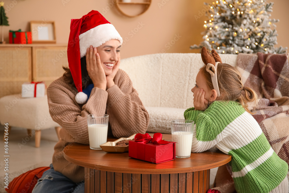 Canvas Prints Young mother and her little daughter at home on Christmas eve