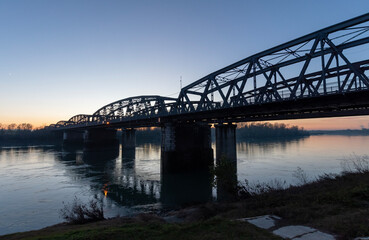 Fototapeta na wymiar Iron bridge over the Po river - Cremona
