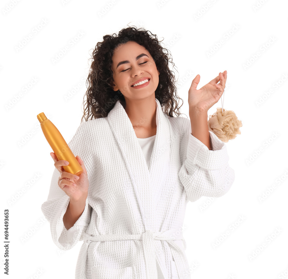 Poster Young African-American woman in bathrobe with shower gel and loofah on white background