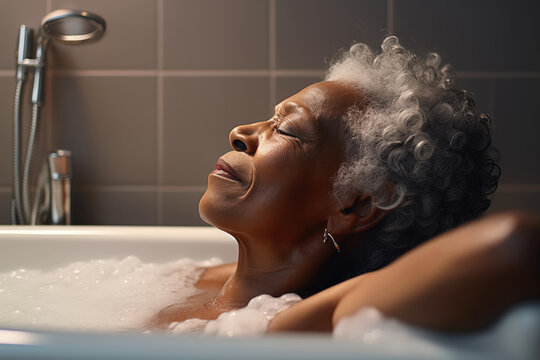 Mature beautiful african american woman relaxing in Bathtub With Foam