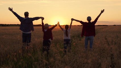 Group Prayer of Sun. Family holiday. Child mom dad walking holding hands. Happy family of farmers...
