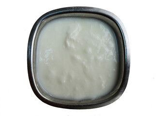 In a small metal bowl, yoghurt is a kind of fermented cow's milk which is traditionally consumed as a side dish for lunch and dinner in Turkey.