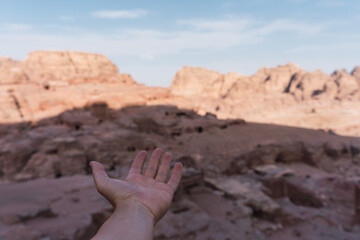 POV of anonymous person's hand showing the beauty of the hidden city of Petra, Jordan. Shot of an...