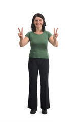 front view of a woman raising two arms showing the victory sign with her fingers on white background.