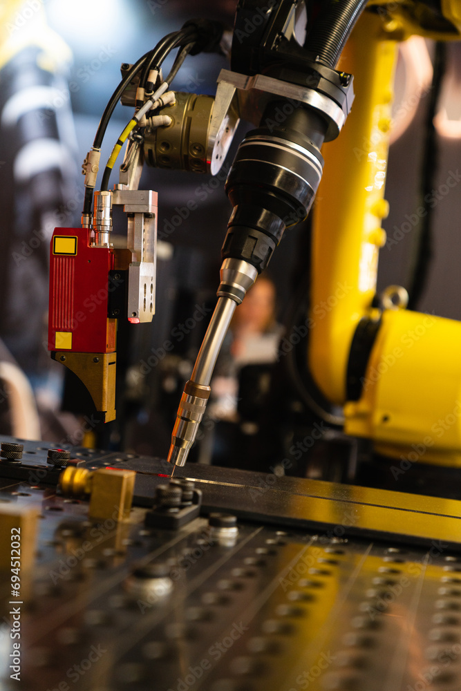 Aufkleber Automatic welding robot in a modern factory in operation
