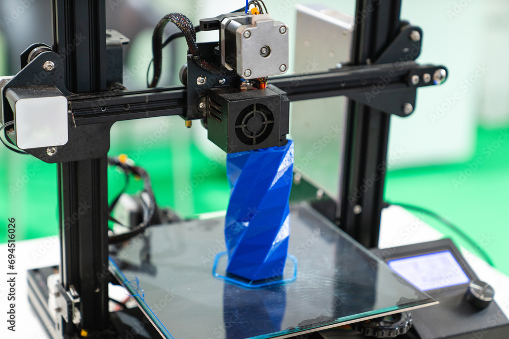 Poster a 3d printer in the laboratory prints a structure from a polymer.