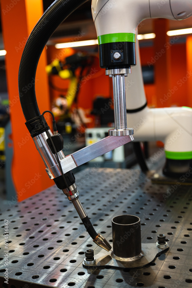 Poster Automatic welding robot in a modern factory in operation