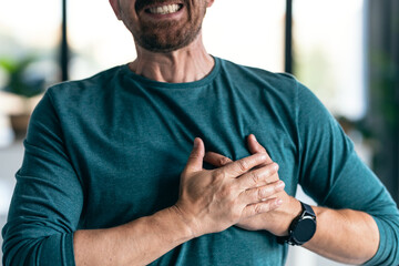 Mature man having a heart attack after receiving bad news while at home