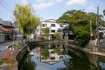 Naklejka premium The city of Yanagawa in Fukuoka has beautiful canals to stroll along with its boats run by skilled boatmen.