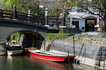 Fototapeta premium The city of Yanagawa in Fukuoka has beautiful canals to stroll along with its boats run by skilled boatmen.