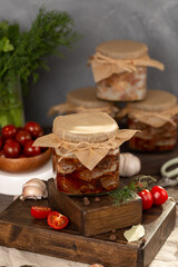 Homemade preparations of wild animal stew in glass jars