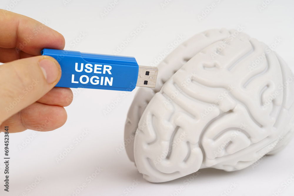 Poster a man inserts a flash drive into his brain with the inscription - user login