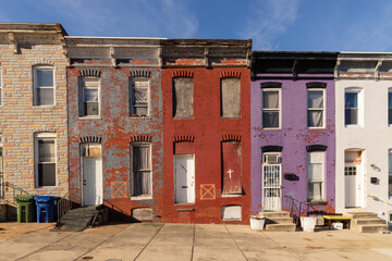 Colorful Vacant Row houses with do not enter symbols in East Baltimore