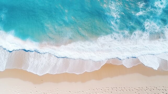 An aerial picture of a sandy beach near the sea with waves, surrounded by a gorgeous stretch of white sand.