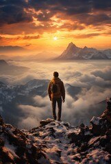 Person watches the sun over a mountain