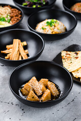 Fried tofu with honey, rice scrambled eggs, Dan Dan noodles with pork, Fuju asparagus marinated in rice vinegar and Naan flatbread.