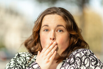 Close-up of the face of a young overweight woman, facial expression