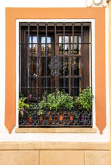 Fototapeta na wymiar Window of typical whitewashed house in Ronda, Malaga