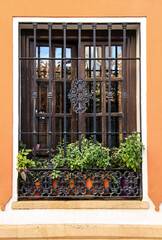 Window of typical whitewashed house in Ronda, Malaga