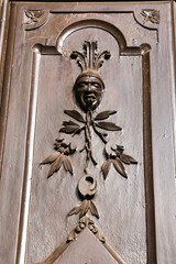 Old wooden door with beautiful carved details