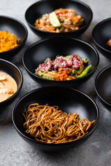 Noodles with onions, meat salad with beef, corn soup with pork and rice noodle pad thai with chicken.