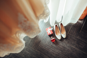 Photo from above details of women's clothing accessories morning of the bride. Heeled shoes,...