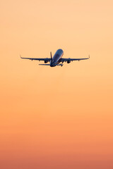 Plane takeoff at sunset. - obrazy, fototapety, plakaty