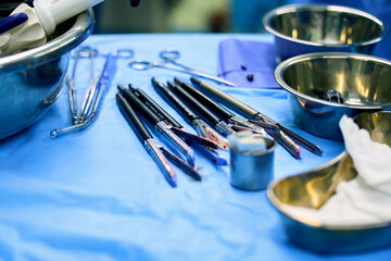 Surgical instruments are on the table in the operating room - obrazy, fototapety, plakaty