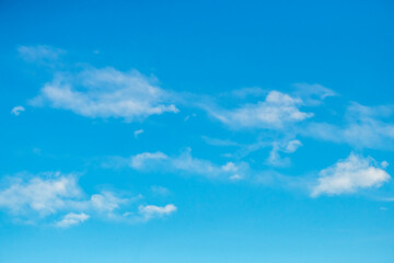 Blue sky with white soft puffy clouds - obrazy, fototapety, plakaty