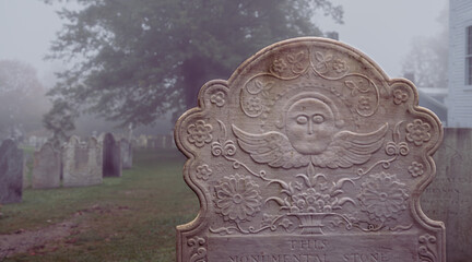 New England graveyard in morning mist