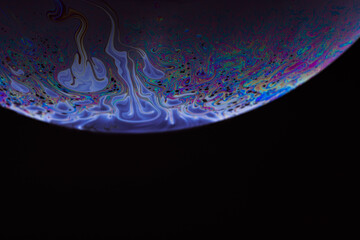 Soap bubble. Streaks of fluid. Surface with psychedelic colors. Abstract background. Space model....