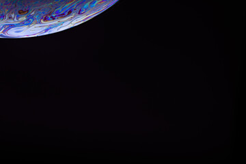 Soap bubble. Streaks of fluid. Surface with psychedelic colors. Abstract background. Space model....