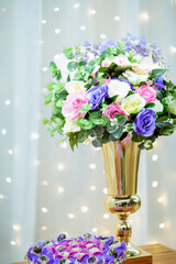 a decorative flower arrangement with pink, purple and white flowers