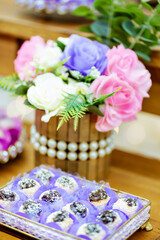 Fototapeta na wymiar a decorative flower arrangement with pink, purple and white flowers
