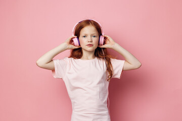 Obraz na płótnie Canvas Sound earphones cute entertainment music listen girl childhood audio little headphones children