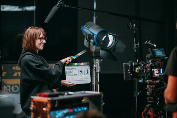 Assistant director with clapperboard on set. Close-up of firecrackers for filming a movie