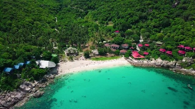 Drone flying towards Aow Luek beach Koh Tao Thailand