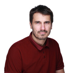Fototapeta premium A picture of a man with a beard, mustache and fashionable hairstyle, dressed in a casual polo shirt, posing in a studio with a serious expression on a light background