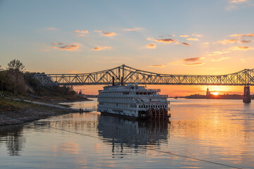 A Paddle Wheeler Cruise Ship at Sunset in Front of the John R Junkin Drive Bridge over the...