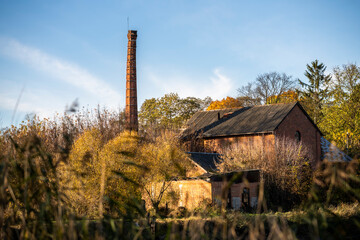 Fototapeta na wymiar The Enchanting Old Brick Distillery Adjacent to an Abandoned Manor – For Sale
