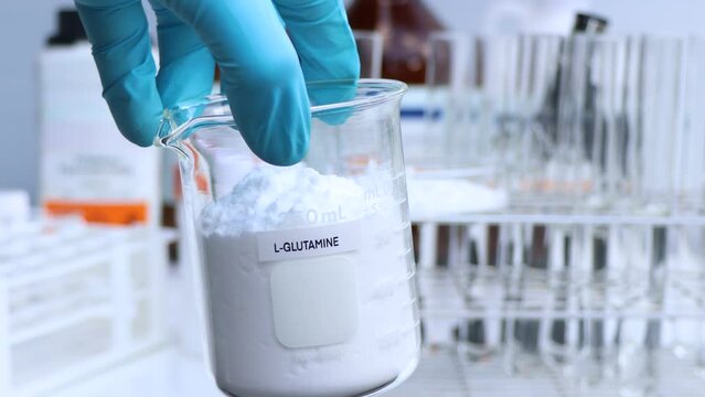 L-GLUTAMINE powder in chemical container , chemical in the laboratory and industry, Raw materials used in production or analysis