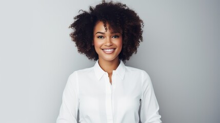 Portrait of a beautiful, smiling black businesswoman on a plain background - obrazy, fototapety, plakaty