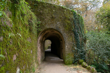 Fototapeta na wymiar Entrance to a cave in the park of the city of Evora, Portugal