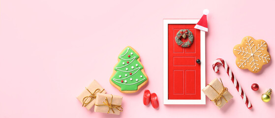 Christmas holiday miniatures with cookies on pink background with space for text