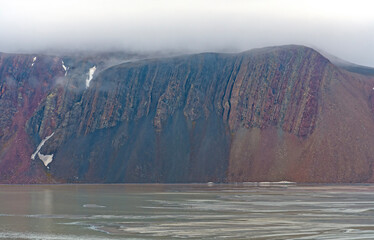 Dramatic Cliffs On An Arctic Fjord