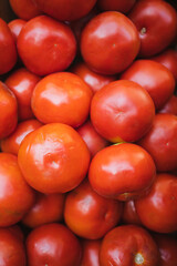 Top view of a group of red tomatoes in a greengrocer in Chile